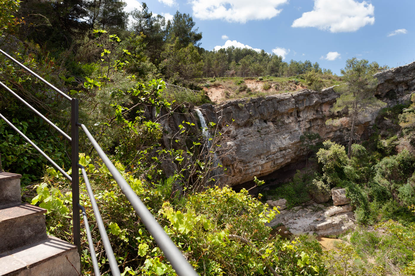 Stairs from terrace with views over the cascade